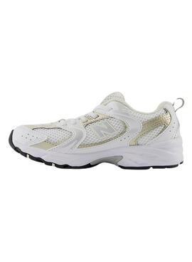 Zapatillas New Balance blancas 530 blancas y doradas para niños