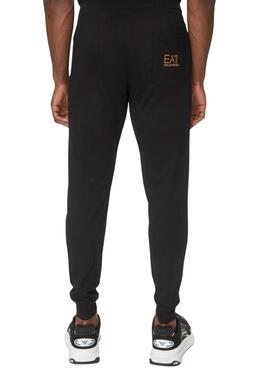 Pantalón Emporio Armani EA7 negro y dorado para hombre